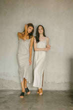 Load image into Gallery viewer, A relaxed maxi dress that gently follows the shape of the body with high slit on one side 
