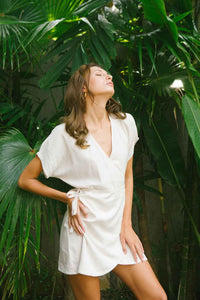 Relaxed wrap dress in soft eggshell color made from linen and rayon blend