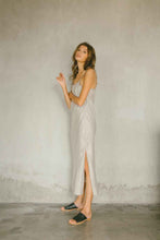 Load image into Gallery viewer, A relaxed maxi dress made from 100% linen in natural color with high slit
