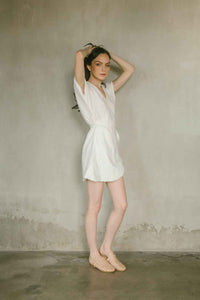 White linen wrap dress with V-neckline