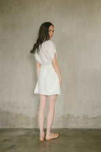 Load image into Gallery viewer, Wrap dress with V-neckline from 100% linen in white. Lined with responsibly harvested rayon
