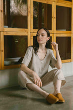 Load image into Gallery viewer, Relaxed fit linen top with a soft V neckline in natural color 
