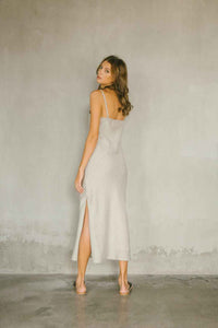 A relaxed maxi dress made from 100% linen in natural color back view